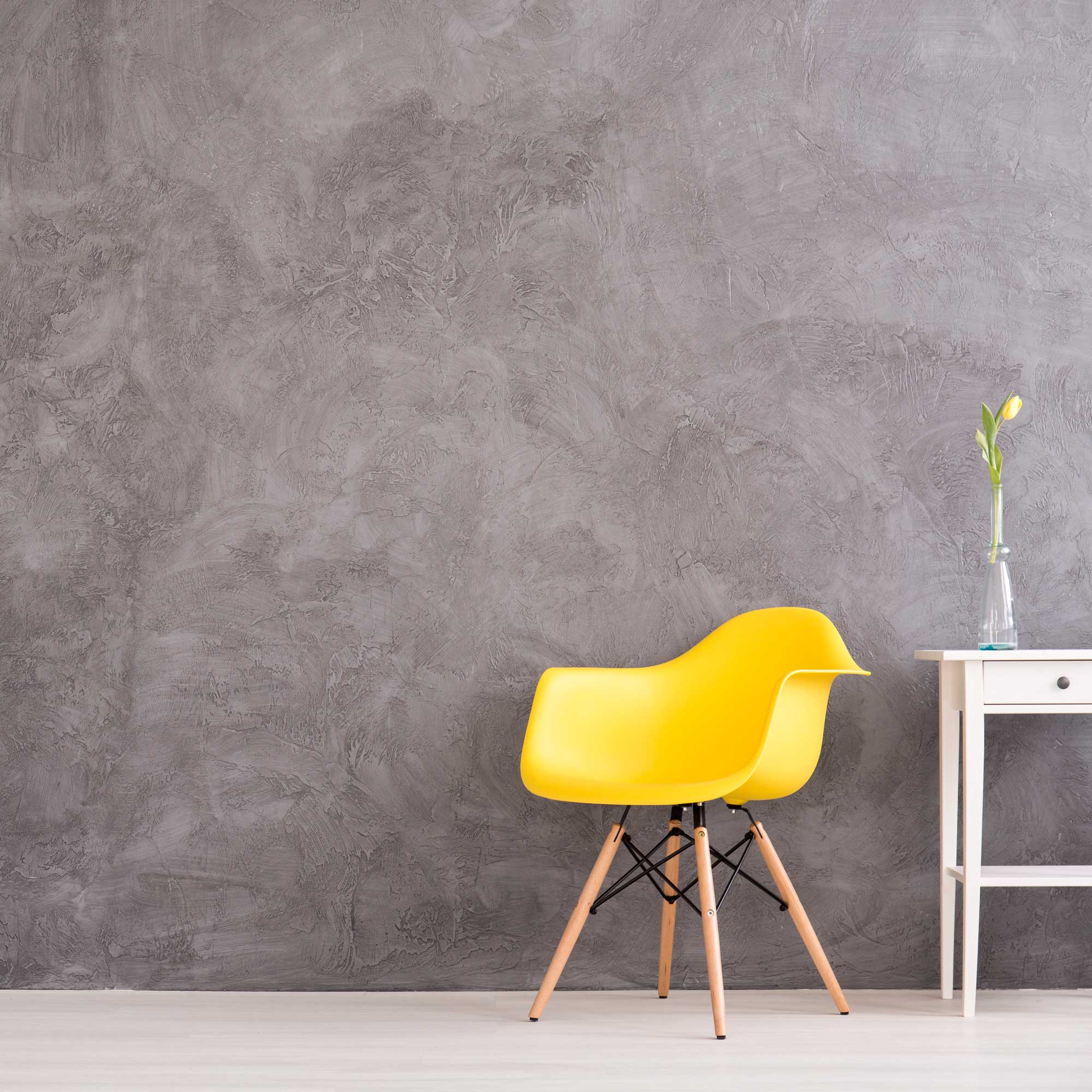 yellow-chair-in-grey-wall-interior-PZED8LY